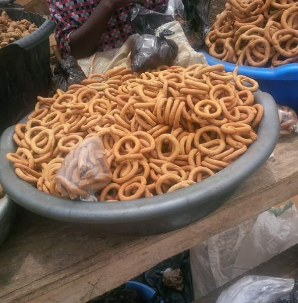 Wonderful display of Kuli Kuli, those delightful peanut bars, showcased with pride by the skilled hands of market women.