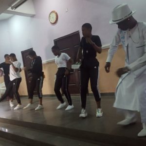 Ekwunife dancing with the students
