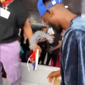 Popular reality star, Whitemoney surprised a fan by pulling his shoes and gifting them out to a fan during an event.