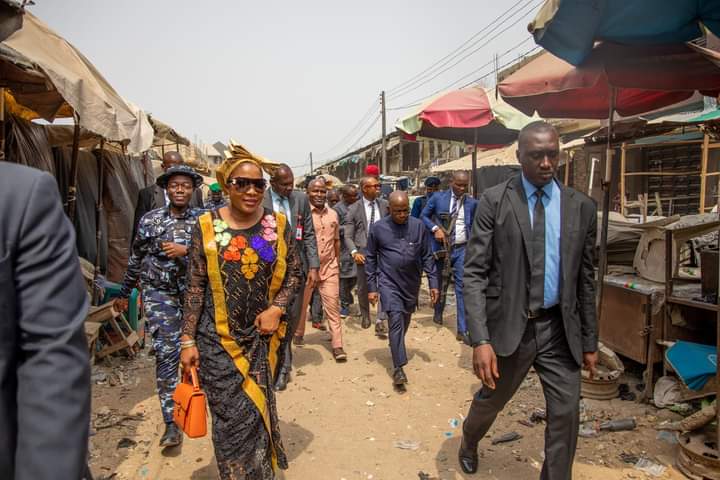 Priscilla Otti, wife of Governor Otti, attends the burnt market site.