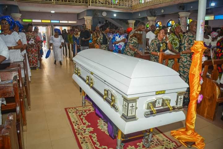 mama lying in state in the church during funeral service